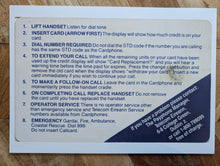 Card with text on a wooden surface